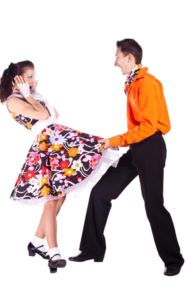 Studio photography on a white background, dancers dressed as rock and roll.